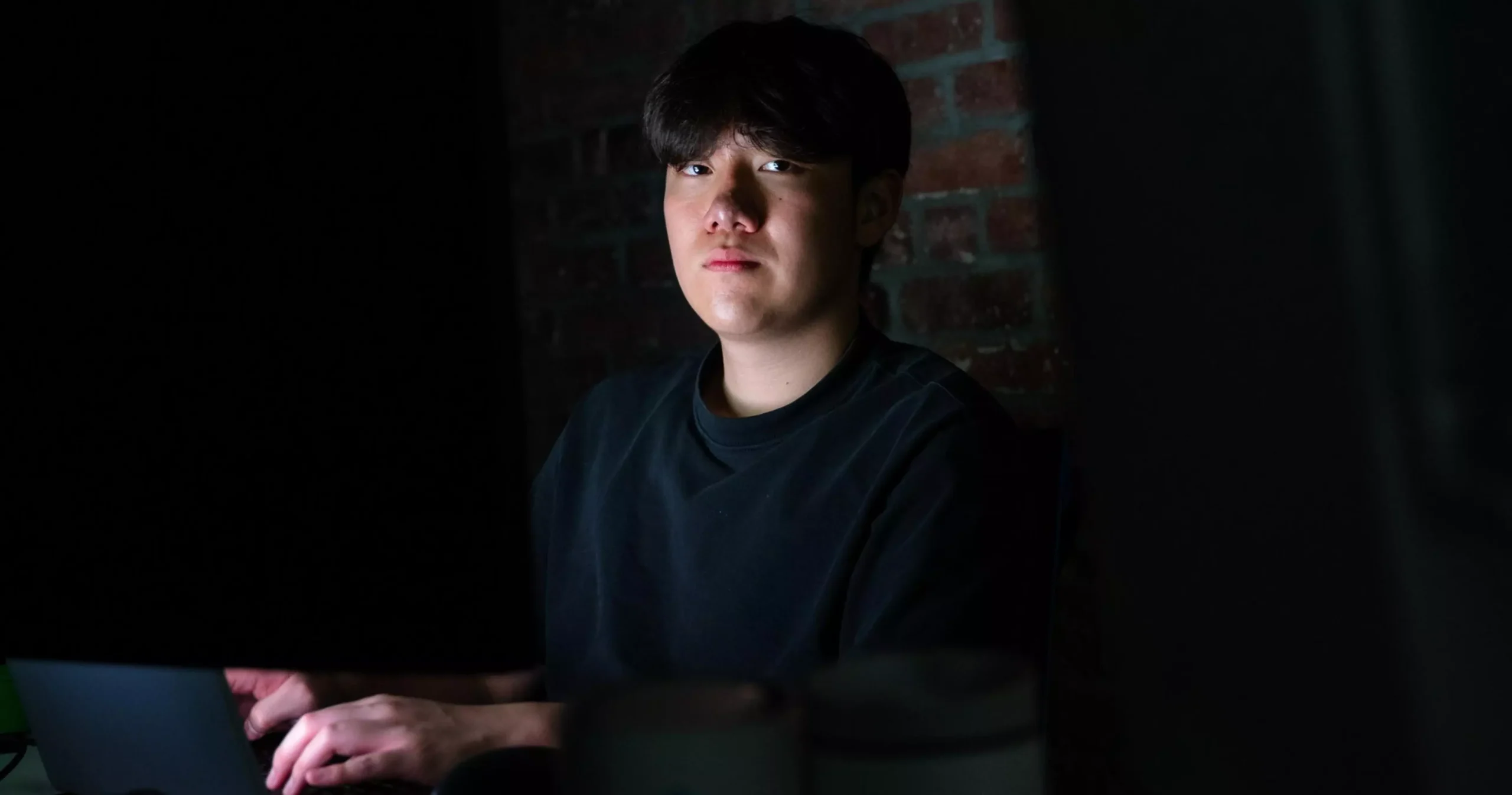 Two San Francisco 49ers players in red and gold uniforms celebrate while Tennessee Titans players in white and navy stand nearby on the football field.