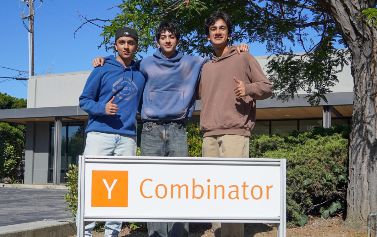 three founders of opennote pose in front of y combinator sign