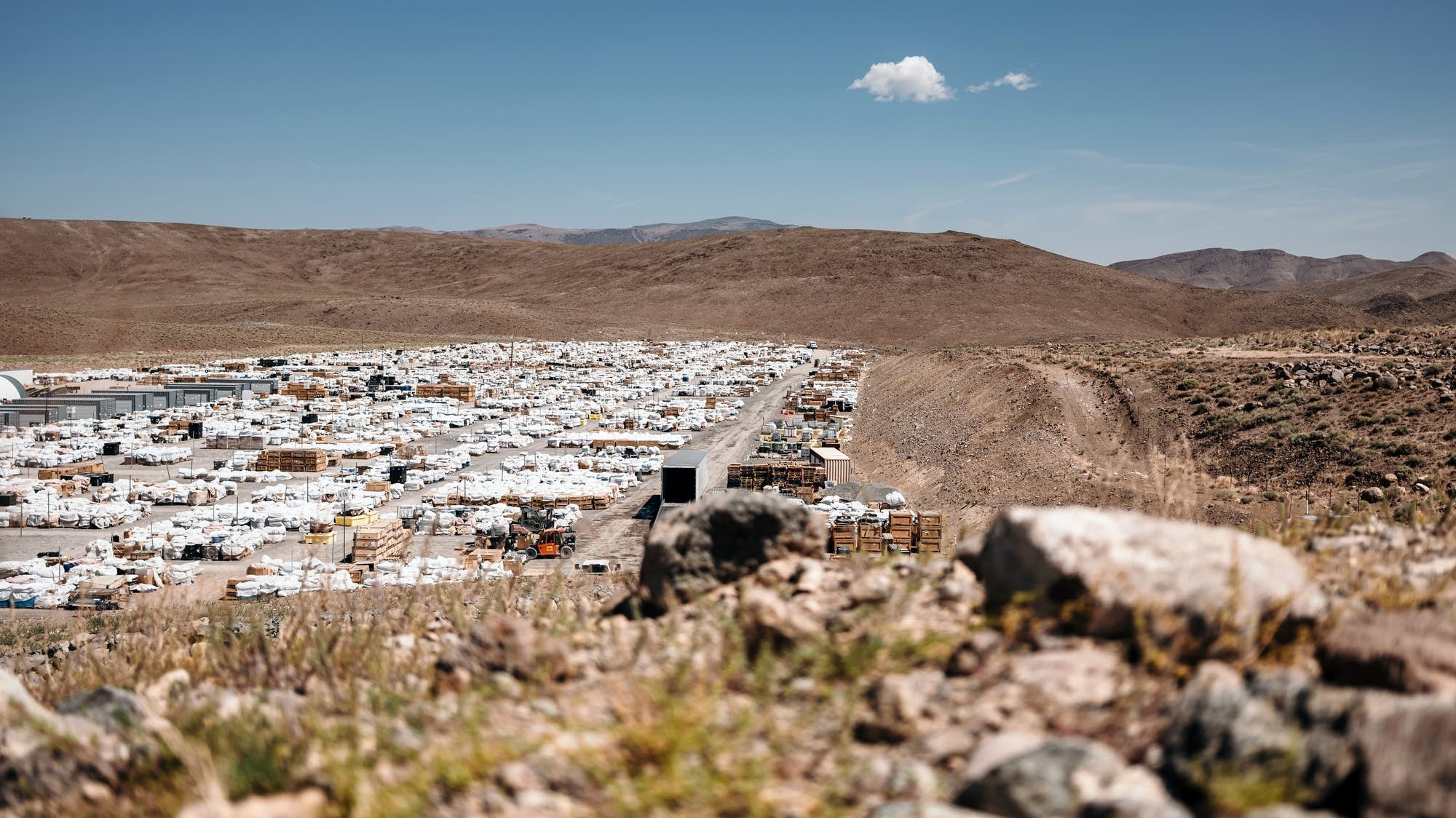 Thousands of used batteries are stockpiled at Redwood Materials, awaiting processing. This receiving yard marks the first step in a closed-loop battery recycling system.