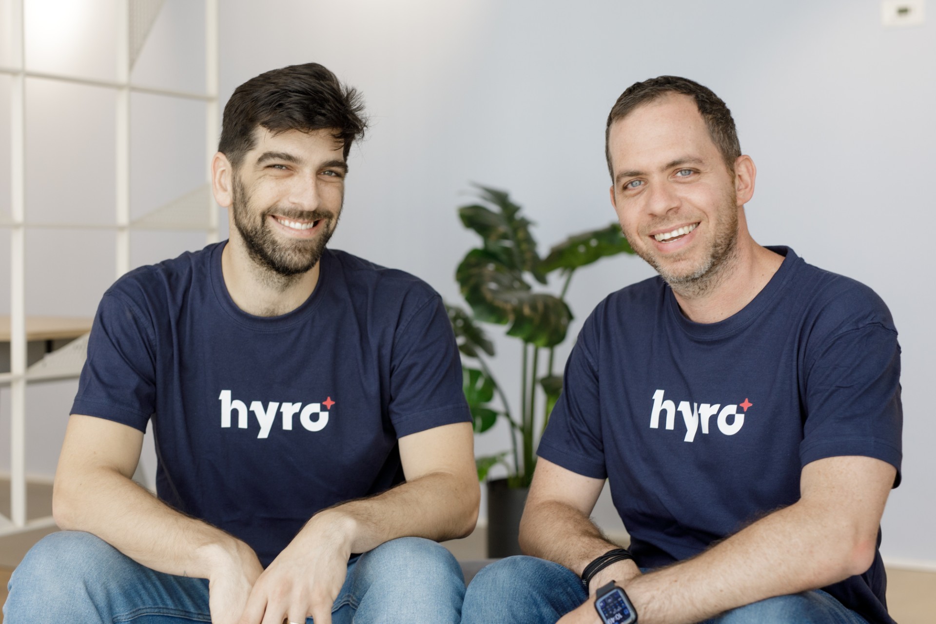 Hyro co-founders Rom Cohen and Israel Kush sitting together