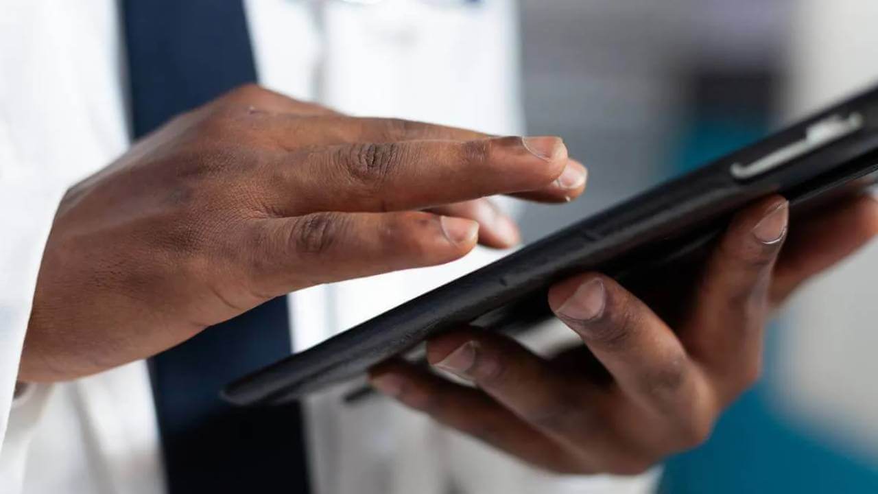 Hands holding a tablet