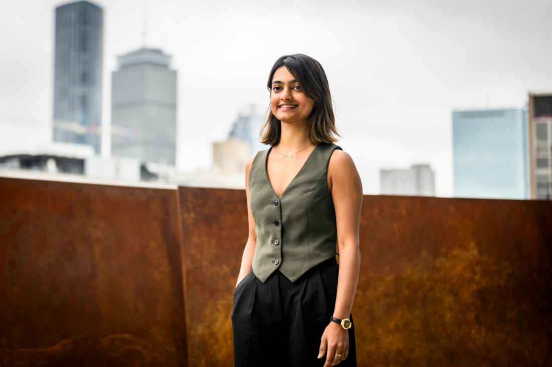 Portrait of Naomi Rajput with the Boston skyline in the background.