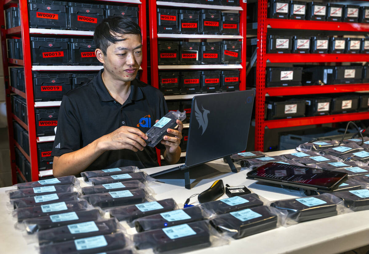 Products specialist Eli Hsieh tests bridges in the warehouse of startup company Dot Ai on Tuesd ...