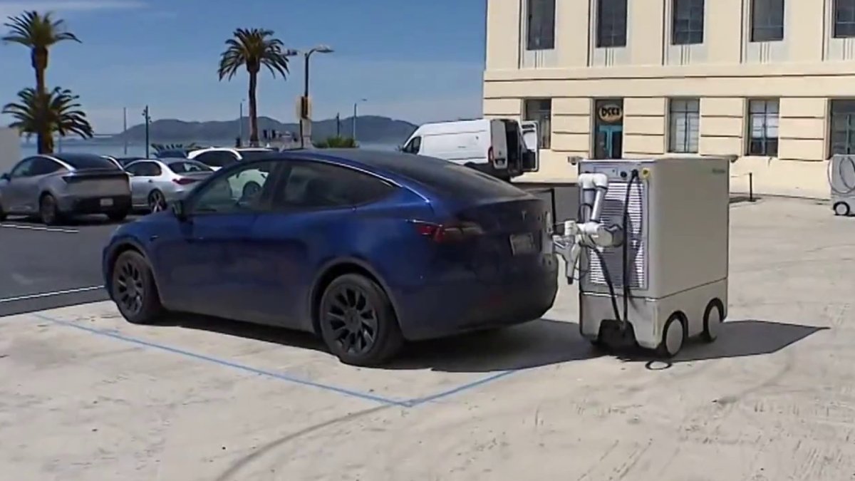 Silicon Valley startup develops robot that goes up to EVs to charge them