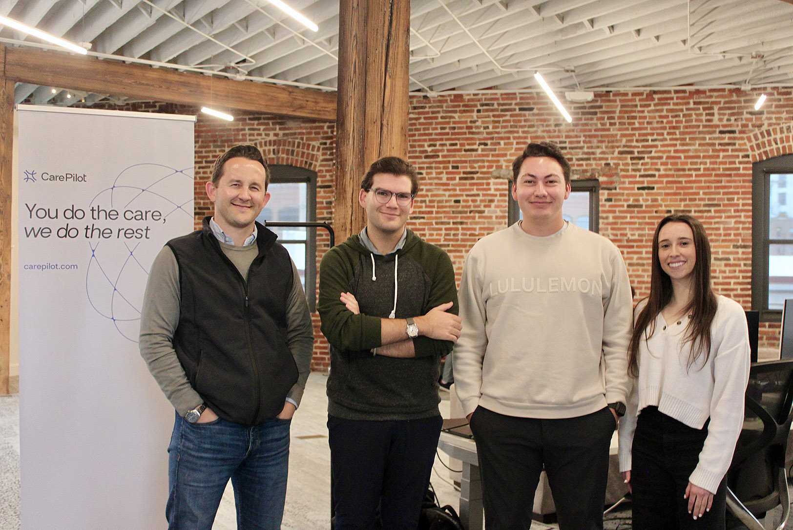 CarePilots team members Kyle Rall, Joseph Tutera, Tanner Held, and Audrey Pino in their new Crossroads office; photo by Nikki Overfelt Chifalu, Startland News