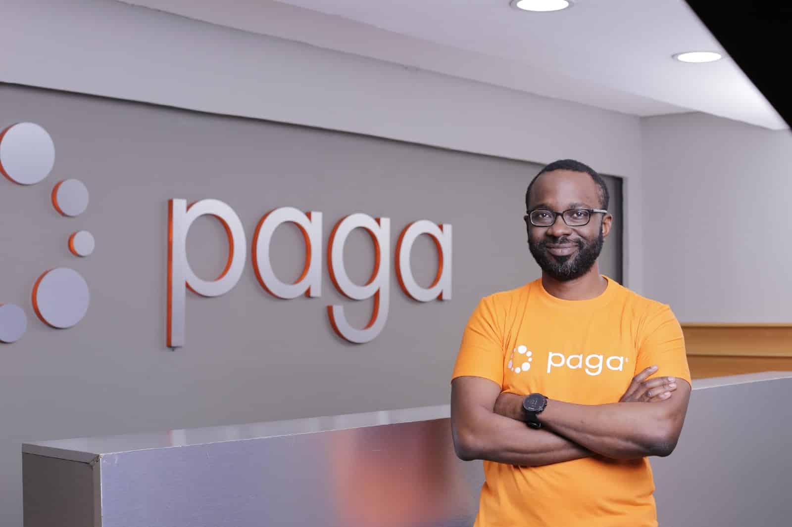 Tayo Oviosu, standing in front of the Paga logo /techpoint.africa