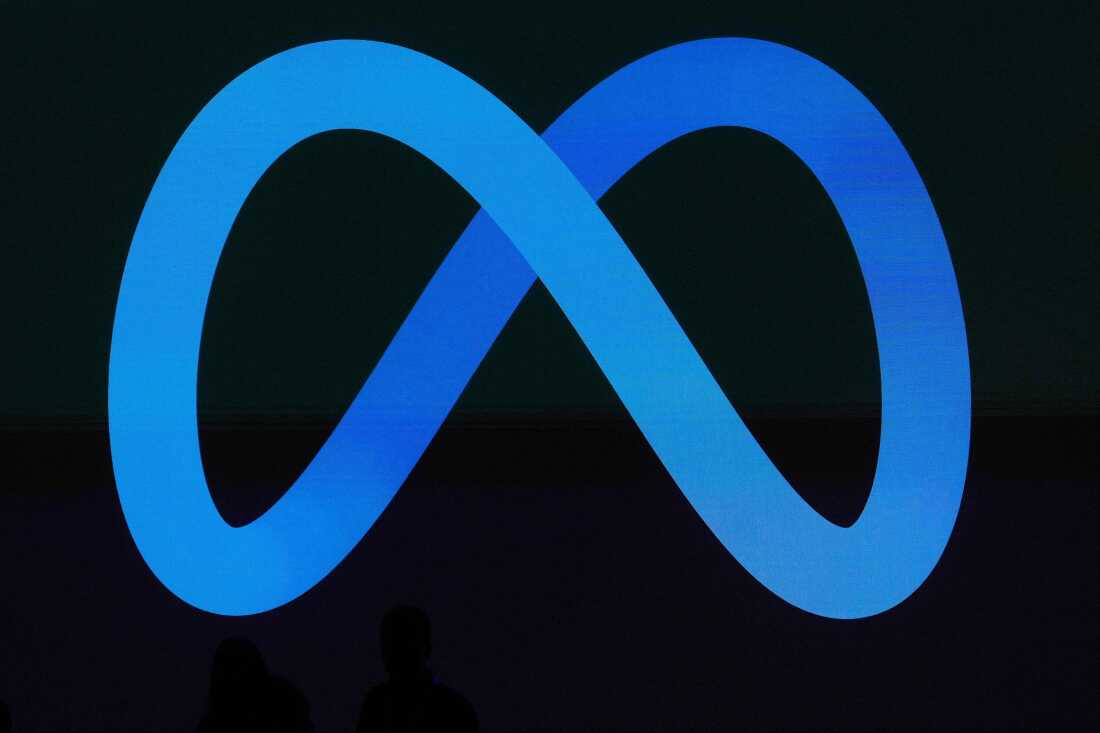 FILE - A Meta logo is shown on a video screen at LlamaCon 2025, an AI developer conference, in Menlo Park, Calif., April 29, 2025.