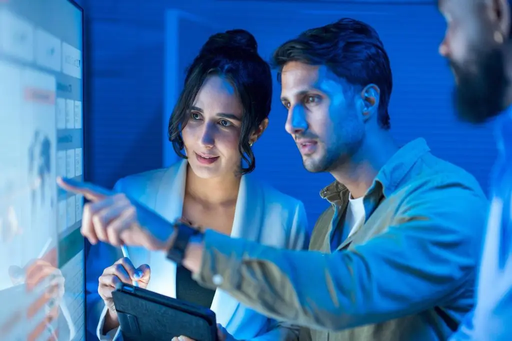 Colleagues reviewing screen