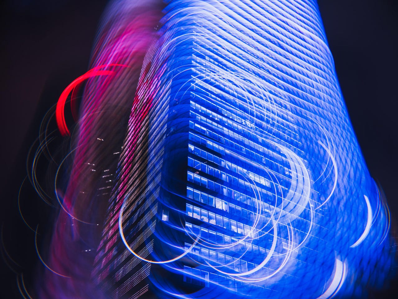 Multiple exposure of brightly lit city, smart city and artificial intelligence concept -