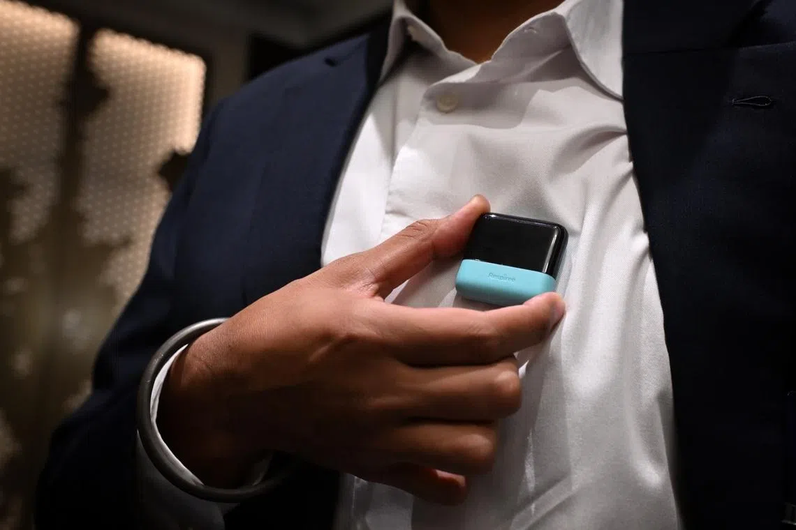 Dr Gurpreet Singh, founder & CEO, Respiree showing where the Respiree device is worn during the Singapore Medical Device Showcase on June 29.