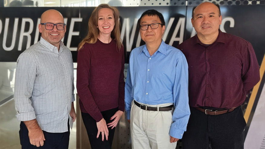 Mike Shepard, Nicole Adams, Nan Kong and Baijian Yang smile at the camera