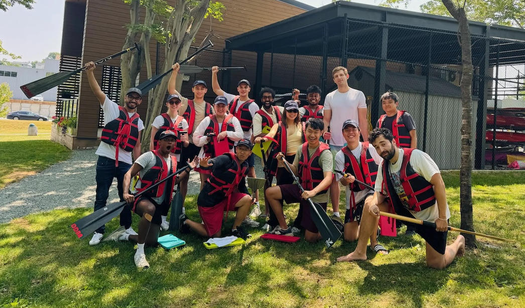 The GPTZero team pose together wearing life jackets and holding paddles.