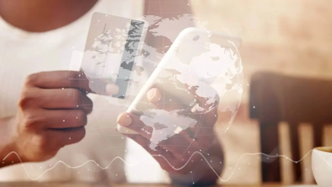 Hands holding a phone and a card