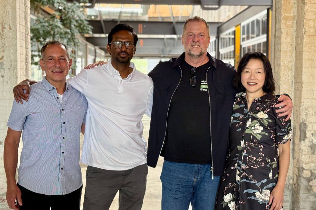 leaders from Vena and Morpheo stanf together with their arms around one another's shoulders.