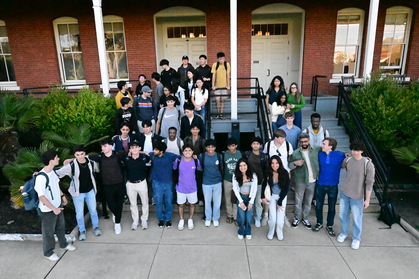 Student participants in the TekTrek startup accelerator gathered in front of their coworking space at the Presidio in San Francisco.