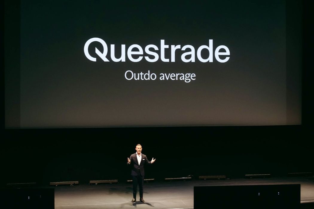 Rob Galaski on stage at a Questrade event
