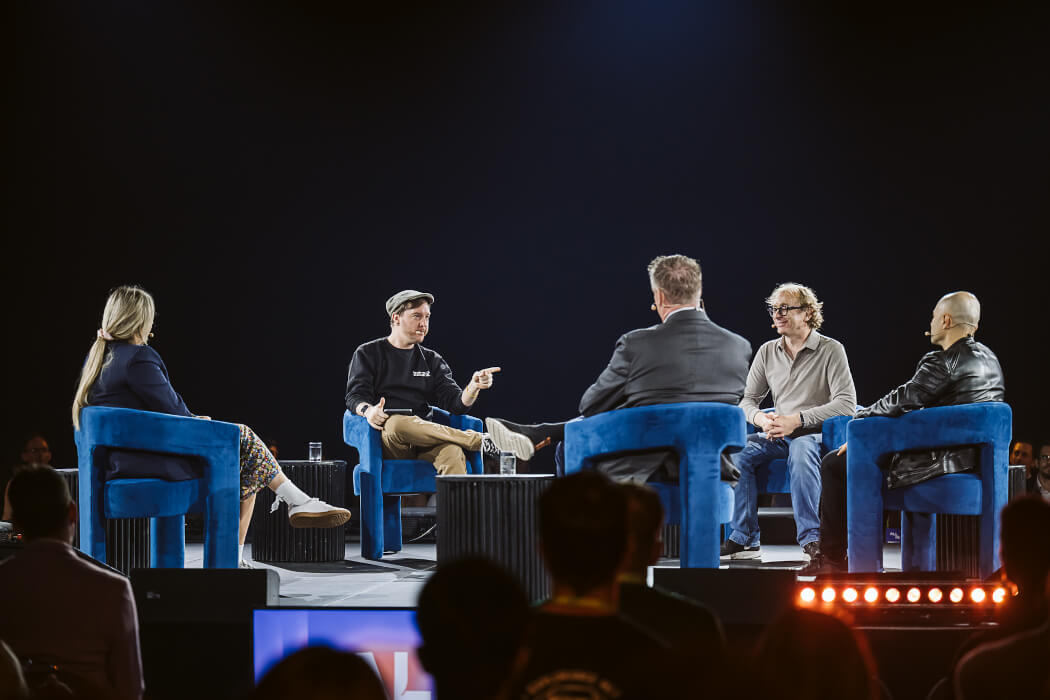 A panel on stage at ALL IN.