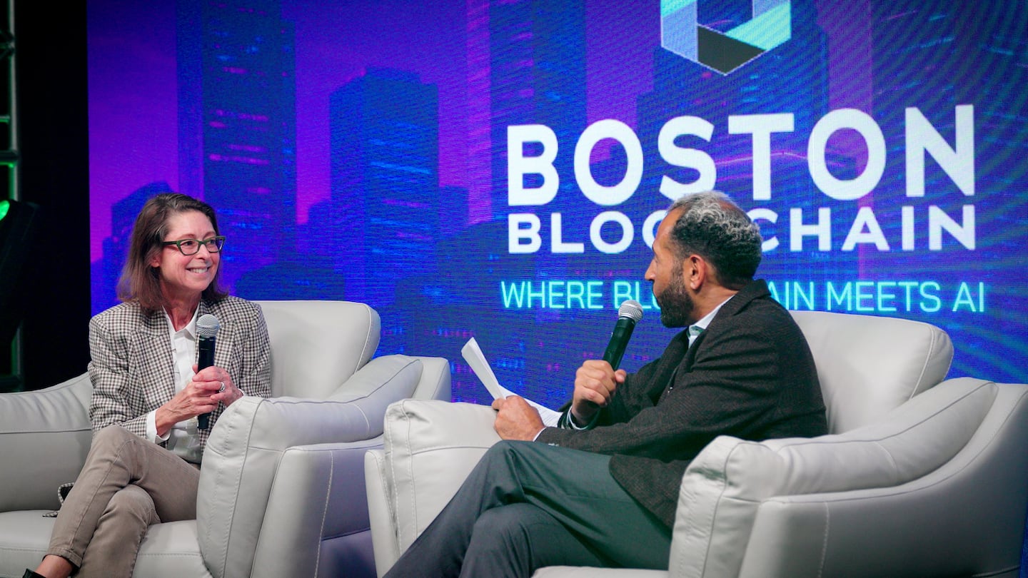 Fidelity Investments CEO Abby Johnson talks with Qubic Labs cofounder Ian Cain at the Boston Blockchain conference in 2025.