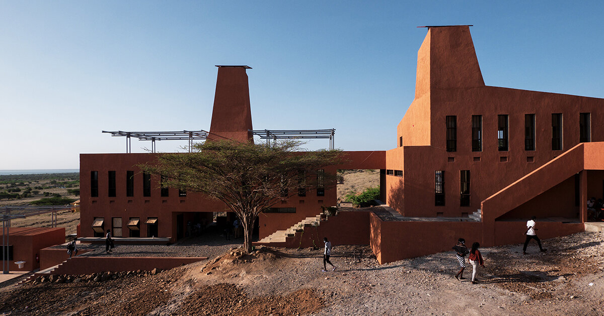tall ventilation towers in kéré architecture’s kenyan education campus mimic termite mounds