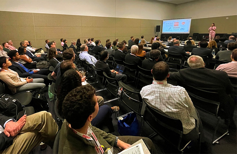 A person giving a talk at the Robotics Summit & Expo.